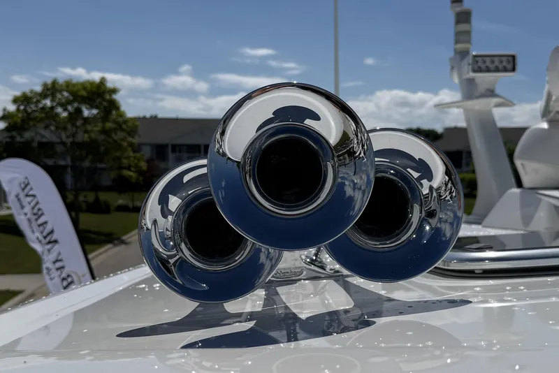 Slide: The Image of Chrome boat horns on 2022 Sabre 48 Salon Express yacht, reflecting sky and surroundings. - 50