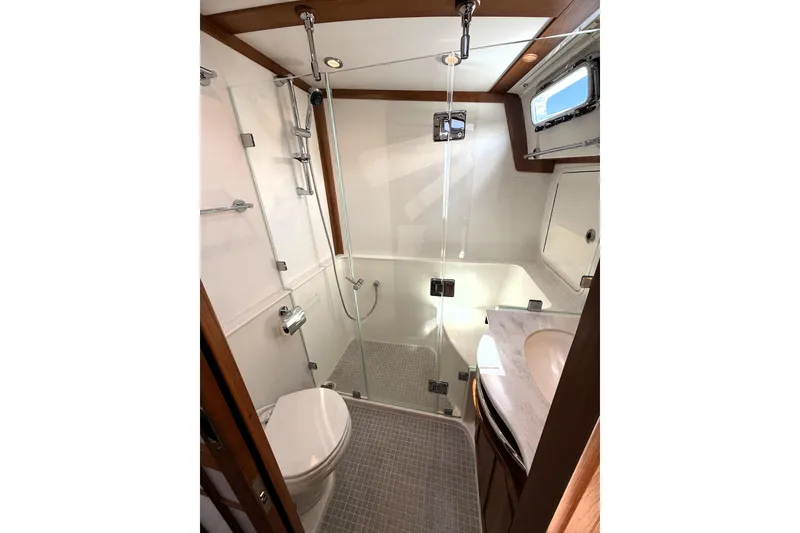 Slide: The Image of Modern bathroom in 2022 Sabre 48 Salon Express yacht with glass shower enclosure. - 35