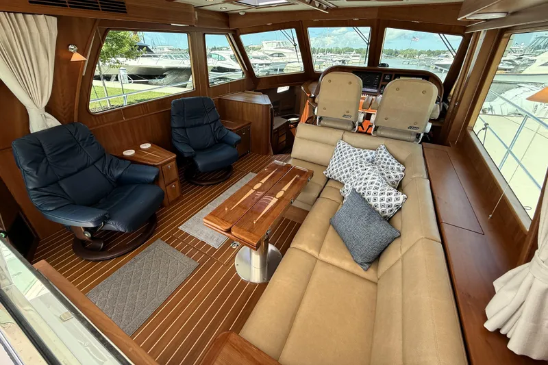 Slide: The Image of Luxurious interior of 2022 Sabre 48 Salon Express yacht with plush seating and elegant wood finishes. - 2