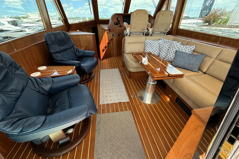 Slide: The Image of Luxurious interior of 2022 Sabre 48 Salon Express yacht with plush seating and elegant wood finishes. - 12
