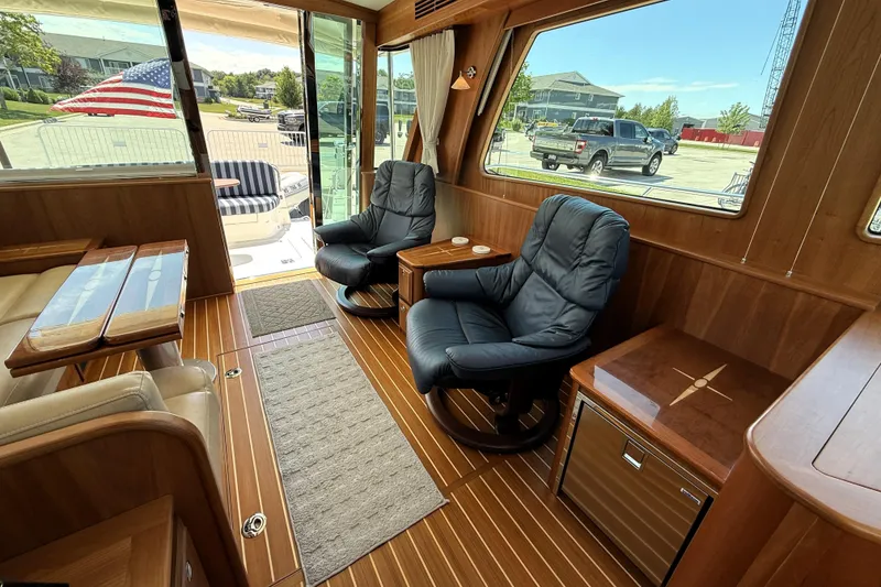Slide: The Image of Interior of 2022 Sabre 48 Salon Express yacht with luxurious seating and wooden finishes. - 19