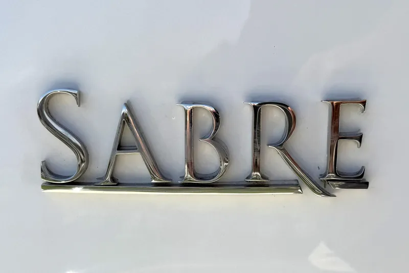 Slide: The Image of Chrome "Sabre" emblem on 2022 Sabre 48 Salon Express yacht. - 45