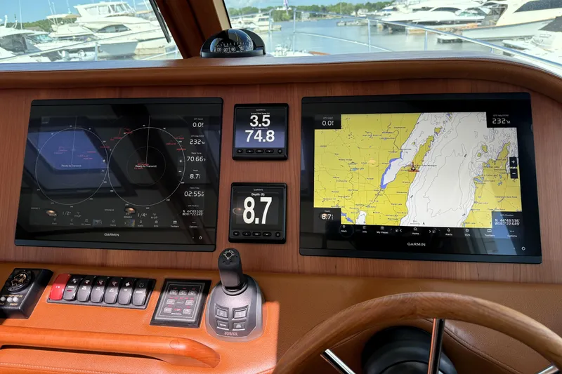 Slide: The Image of Dashboard of 2022 Sabre 48 Salon Express with Garmin navigation displays. - 25