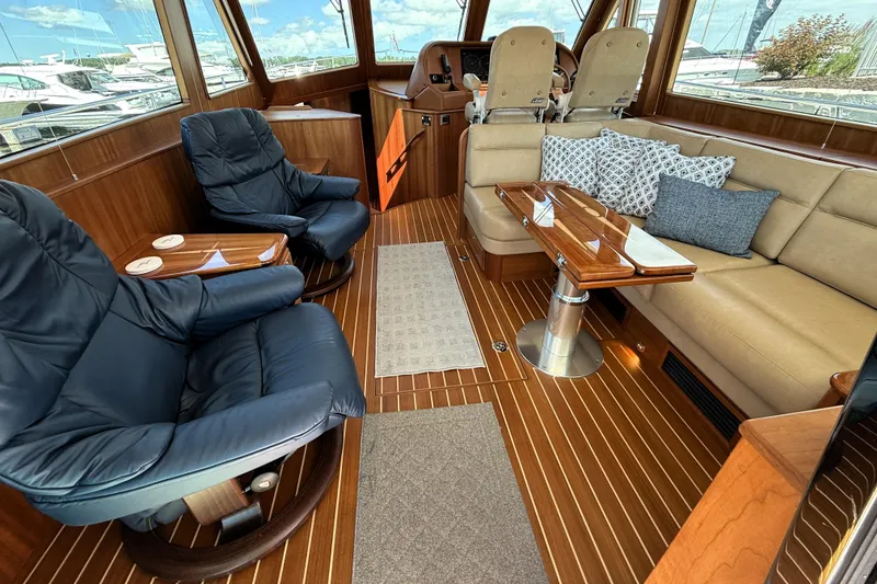 Slide: The Image of Luxurious interior of 2022 Sabre 48 Salon Express yacht with plush seating and elegant wood finishes. - 11