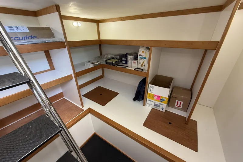 Slide: The Image of Interior storage area of 2022 Sabre 48 Salon Express yacht with shelves and boxes. - 41
