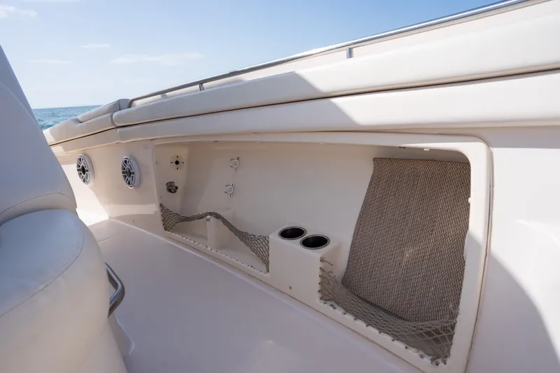 Slide: The Image of 2015 Grady-White Canyon 376 boat interior with storage compartments and cup holders. - 25