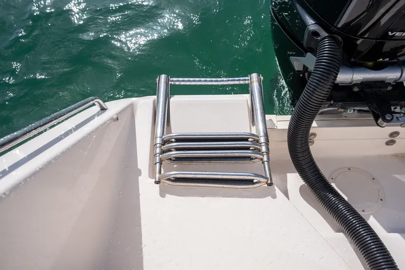 Slide: The Image of Stainless steel ladder on 2015 Grady-White Canyon 376 boat, near outboard motor. - 34