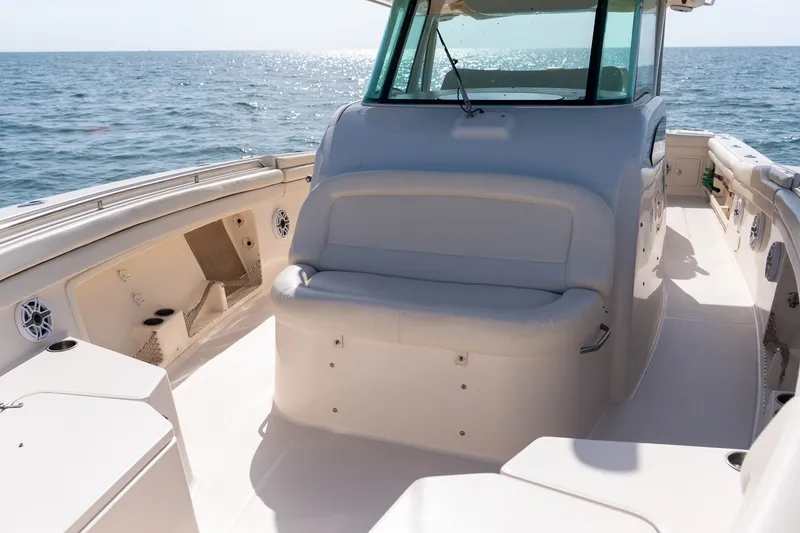 Slide: The Image of 2015 Grady-White Canyon 376 boat interior with seating, on open water. - 22