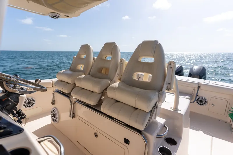 Slide: The Image of Luxury seating on 2015 Grady-White Canyon 376 boat, ocean view in background. - 18