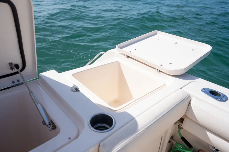 Slide: The Image of 2015 Grady-White Canyon 376 boat with open storage compartments on the deck. - 33