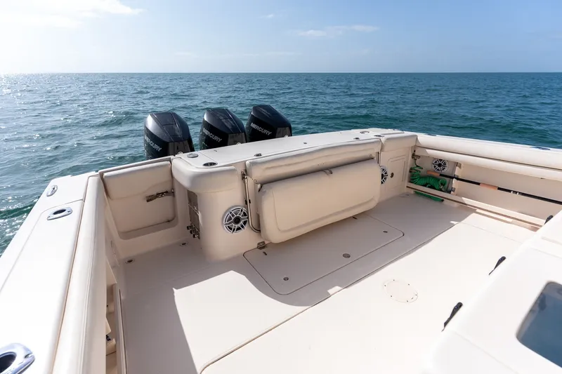 Slide: The Image of 2015 Grady-White Canyon 376 boat with triple Mercury engines on open sea. - 31