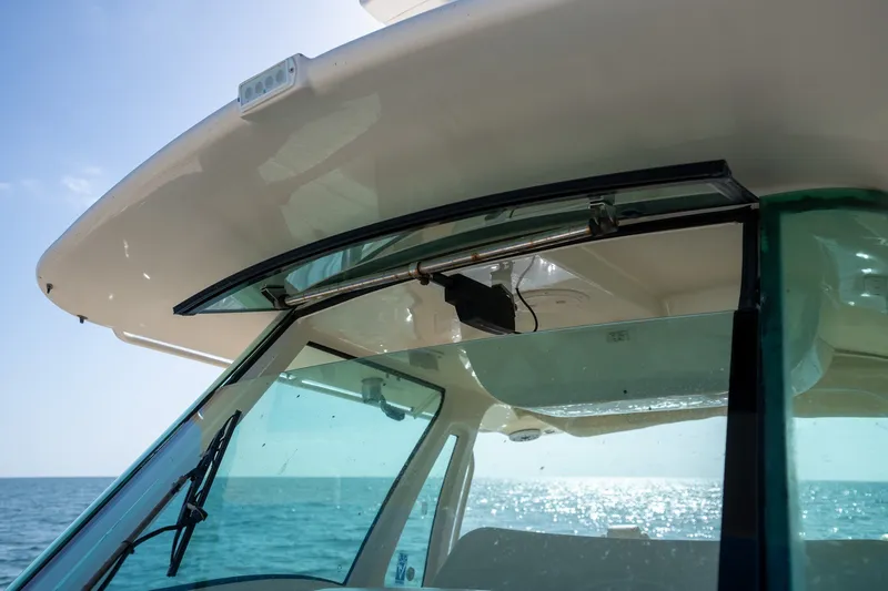 Slide: The Image of 2015 Grady-White Canyon 376 boat windshield with ocean view. - 26