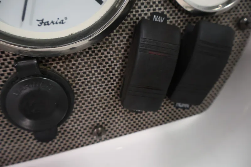 Slide: The Image of Close-up of 2009 Four Winns H180 dashboard switches and gauge. - 21