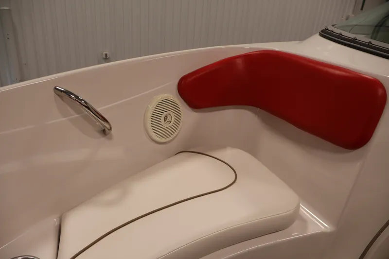 Slide: The Image of Interior seating of 2009 Four Winns H180 boat with red and white upholstery. - 14