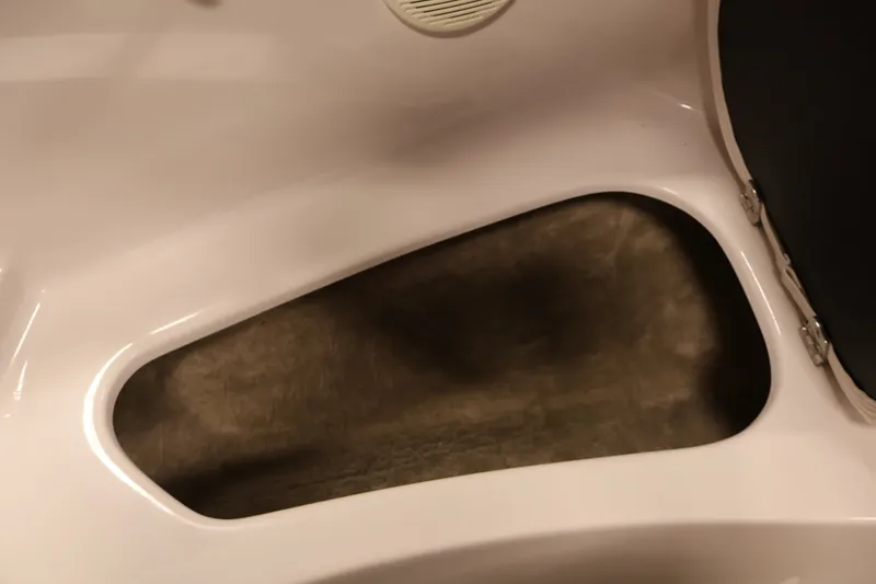 Slide: The Image of Storage compartment in 2009 Four Winns H180 boat interior. - 15