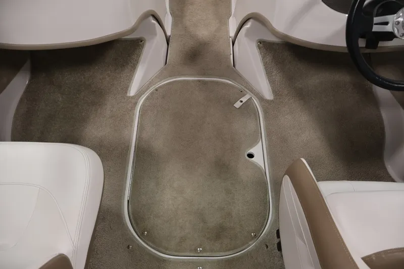Slide: The Image of Interior of 2009 Four Winns H180 boat showing carpeted floor and seating area. - 30