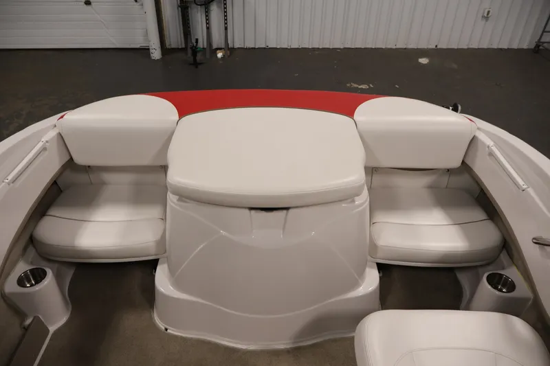 Slide: The Image of 2009 Four Winns H180 boat interior with white seating and red accents. - 32