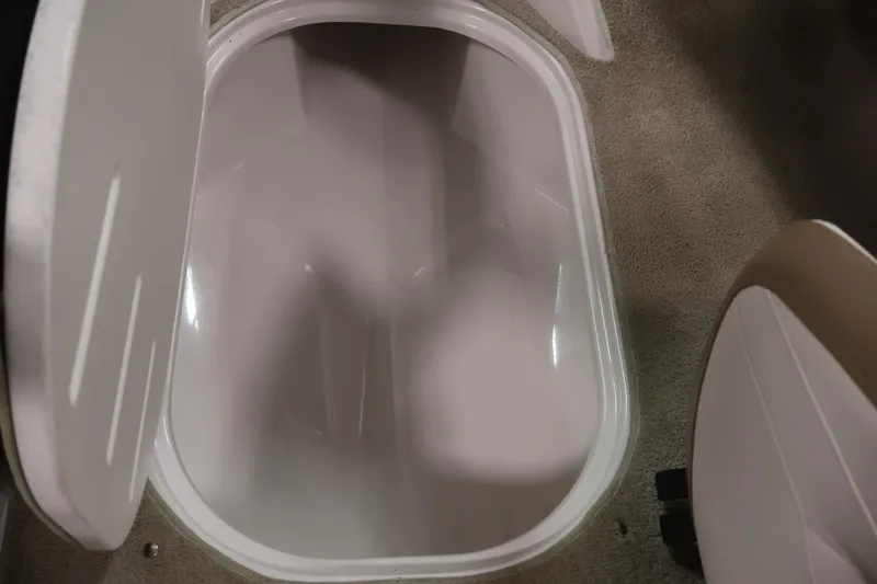 Slide: The Image of Storage compartment in 2009 Four Winns H180 boat, open and empty. - 31