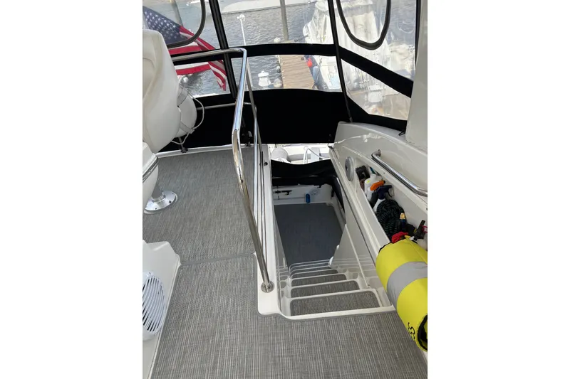 Slide: The Image of Interior view of 2001 Silverton 42 Convertible yacht with stairs and equipment storage. - 21