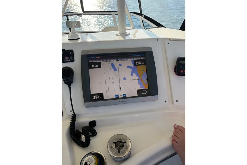 Slide: The Image of 2001 Silverton 42 Convertible boat dashboard with Garmin GPS navigation system. - 26