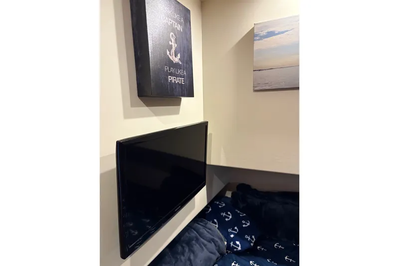 Slide: The Image of Interior of 2001 Silverton 42 Convertible with nautical decor and wall-mounted TV. - 20