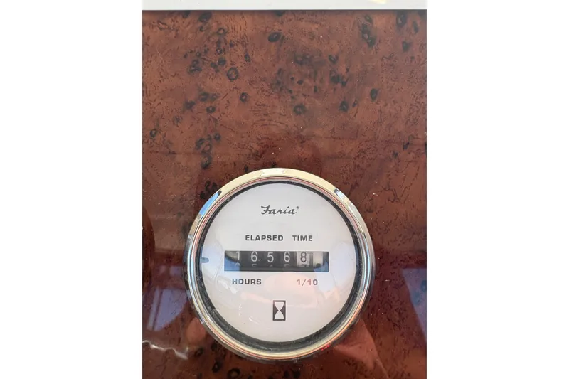 Slide: The Image of Hour meter showing 6568 hours on 2001 Silverton 42 Convertible boat. - 27
