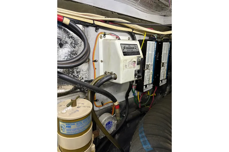 Slide: The Image of Engine room of 2001 Silverton 42 Convertible with oil changer system and wiring. - 29