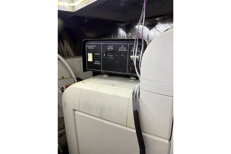 Slide: The Image of Control panel inside a 2001 Silverton 42 Convertible boat engine room. - 30