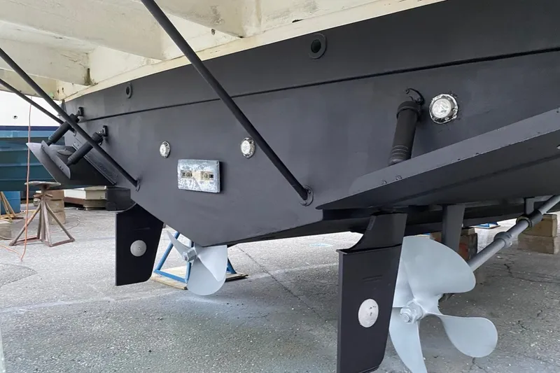 Slide: The Image of Underside view of a 2001 Silverton 42 Convertible boat with visible propellers. - 35