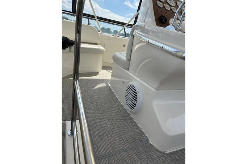 Slide: The Image of Interior view of 2001 Silverton 42 Convertible yacht cockpit with seating and controls. - 23