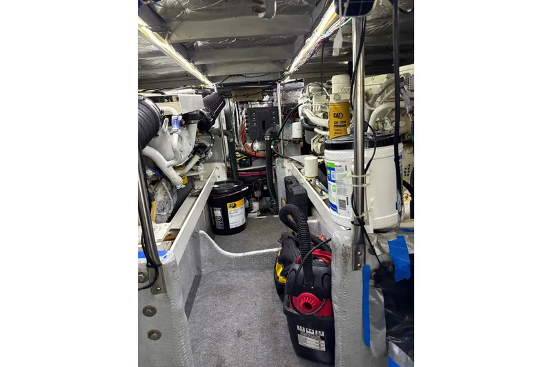 Slide: The Image of Engine room of a 2001 Silverton 42 Convertible yacht, showcasing machinery and equipment. - 31
