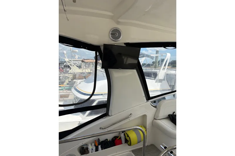 Slide: The Image of Interior view of 2001 Silverton 42 Convertible yacht with dockside scenery. - 22