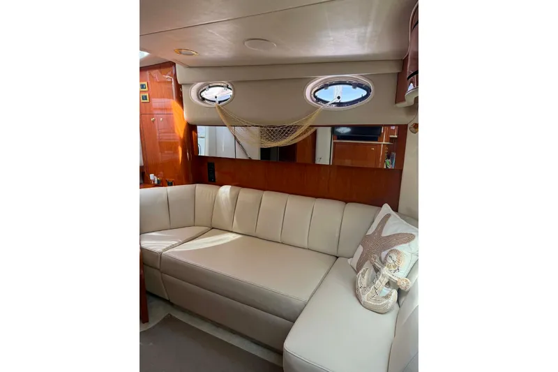 Slide: The Image of Luxurious interior of 1999 Sea Ray 450 Sundancer yacht with cream leather seating. - 20