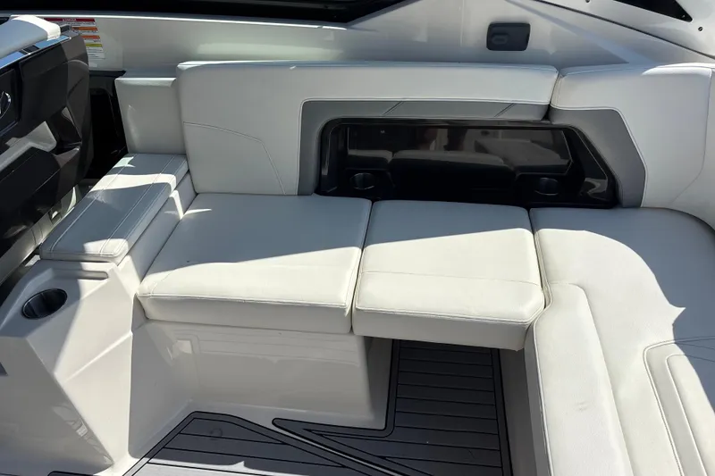 Slide: The Image of Luxurious white seating on a 2014 Monterey 328SS Super Sport boat interior. - 25