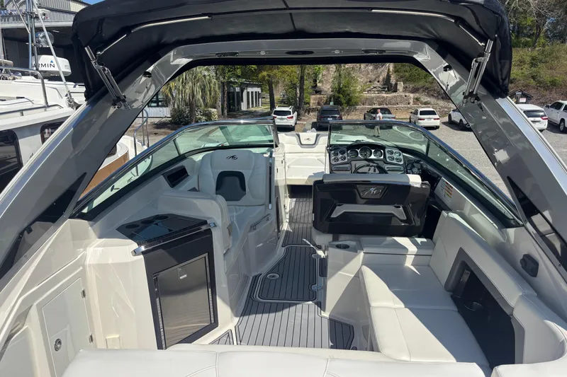 Slide: The Image of 2014 Monterey 328SS Super Sport boat interior with luxurious seating and modern dashboard. - 21