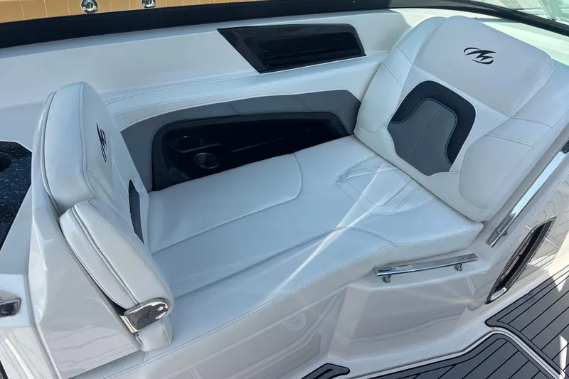 Slide: The Image of Luxurious seating in 2014 Monterey 328SS Super Sport boat, featuring white upholstery and cup holders. - 23