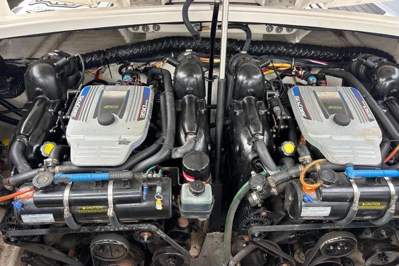Slide: The Image of Twin engines of a 2014 Monterey 328SS Super Sport boat, showcasing Seacore 350 MAG technology. - 36