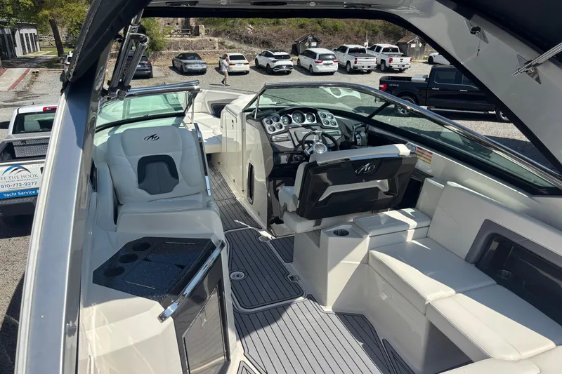Slide: The Image of 2014 Monterey 328SS Super Sport boat interior with luxurious seating and modern dashboard. - 22