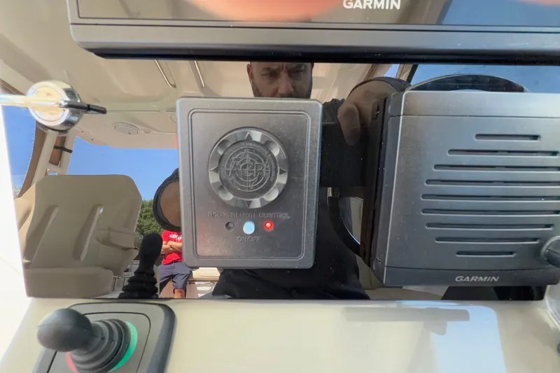 Slide: The Image of Control panel of a 2016 Pursuit DC 325 Dual Console boat with Garmin equipment. - 38
