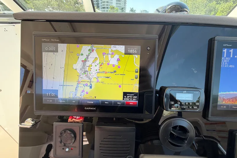 Slide: The Image of Garmin GPS display on 2016 Pursuit DC 325 Dual Console boat dashboard. - 37