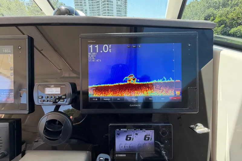 Slide: The Image of Dashboard of a 2016 Pursuit DC 325 Dual Console with Garmin navigation display. - 36