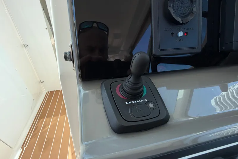 Slide: The Image of Control panel of a 2016 Pursuit DC 325 Dual Console boat with Lewmar joystick. - 34