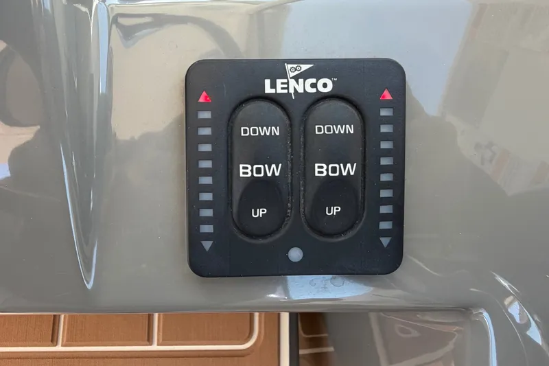 Slide: The Image of Lenco trim tab control panel on 2016 Pursuit DC 325 Dual Console boat. - 40