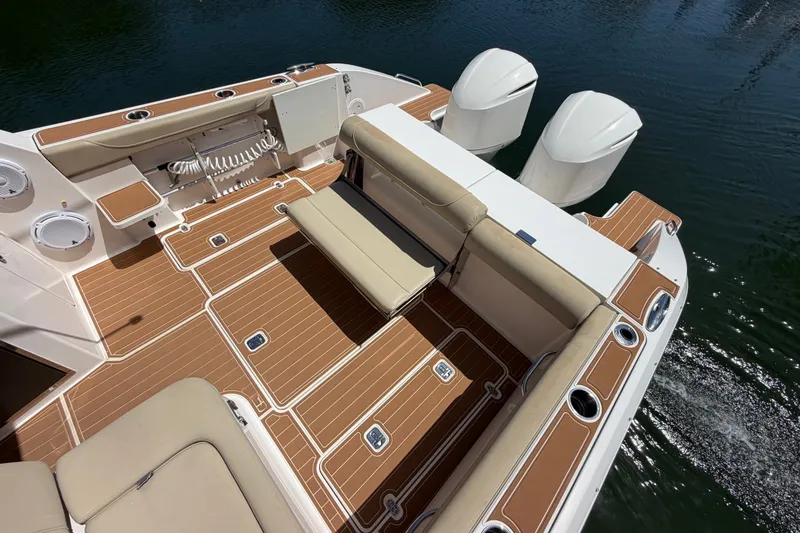 Slide: The Image of 2016 Pursuit DC 325 Dual Console boat with spacious deck and twin engines. - 12