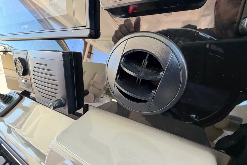 Slide: The Image of Control panel of a 2016 Pursuit DC 325 Dual Console boat with Garmin display. - 39