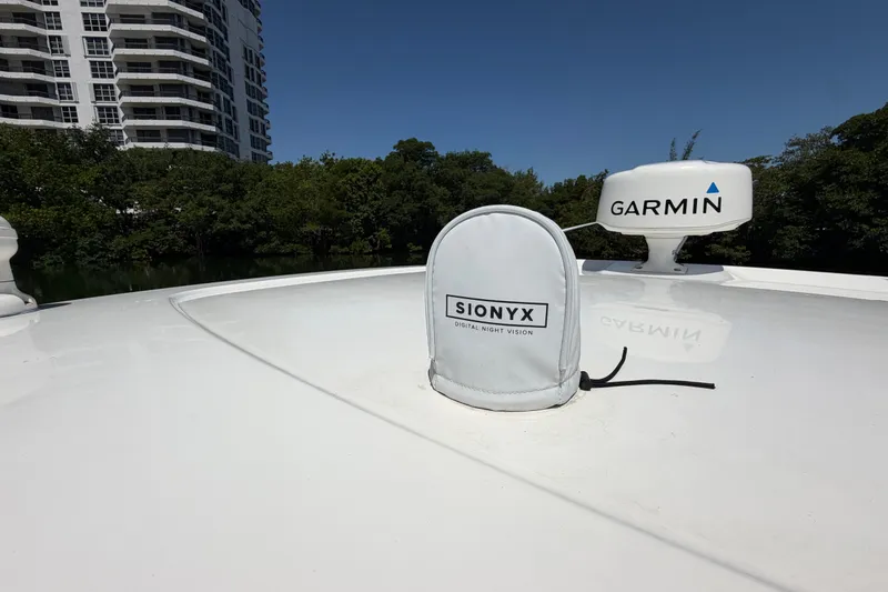 Slide: The Image of 2016 Pursuit DC 325 Dual Console boat with Garmin and Sionyx equipment on deck. - 52