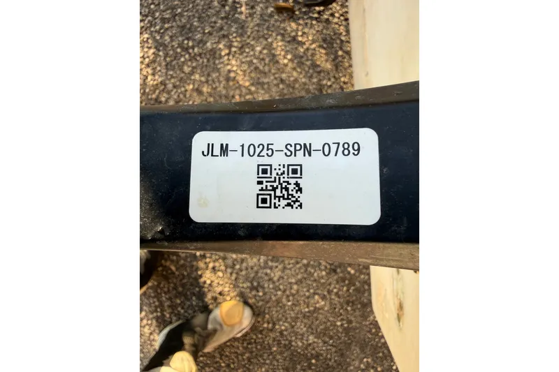 Slide: The Image of QR code label on Mako 235, 1977 model, with code JLM-1025-SPN-0789. - 38