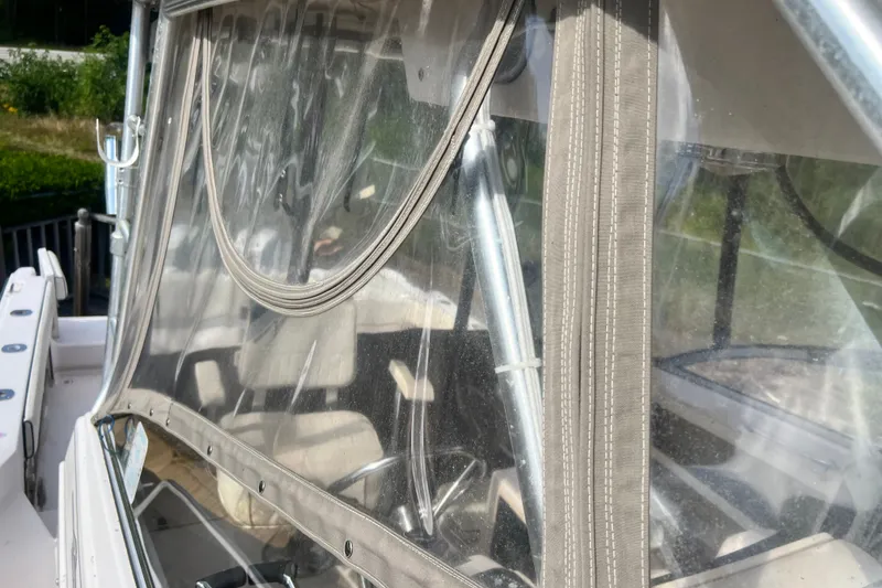 Slide: The Image of Close-up of a 1996 Grady-White Marlin 300 boat's clear vinyl enclosure. - 34
