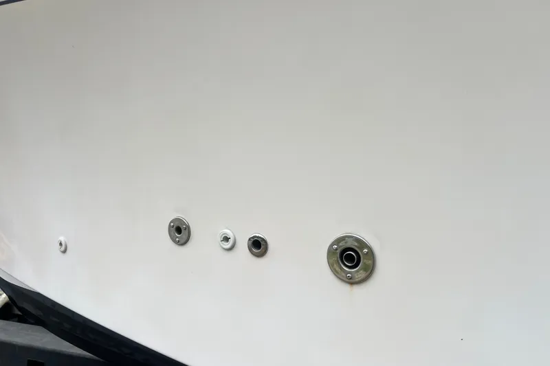 Slide: The Image of Close-up of 1996 Grady-White Marlin 300 boat hull with metal fittings. - 30
