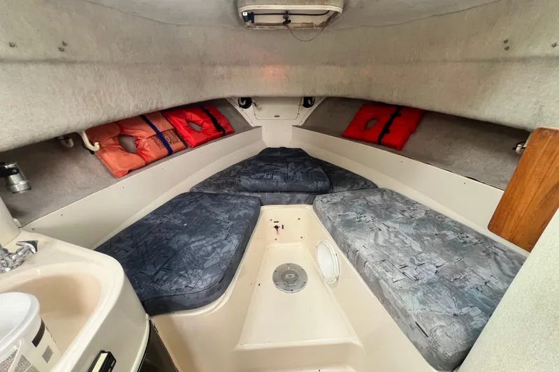 Slide: The Image of Interior cabin of 1996 Grady-White Marlin 300 boat with cushions and life jackets. - 11